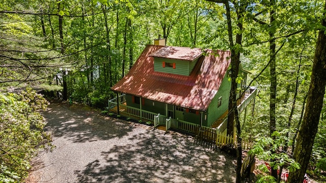127 Berry Reister Dr, Blairsville, GA 30512 - chalet / cabin with a porch, a chimney, metal roof, and a wooded view