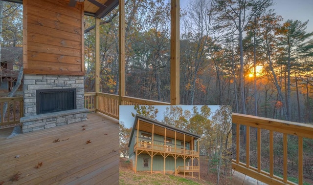 unfurnished sunroom with an outdoor stone fireplace