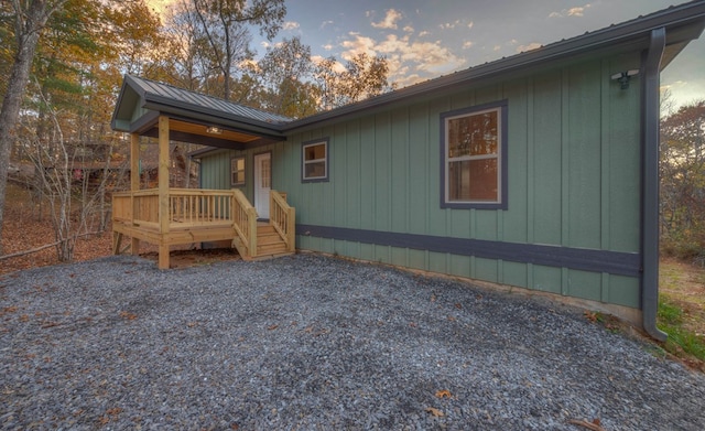 property exterior at dusk with a deck