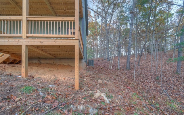 exterior space with a deck and central air condition unit