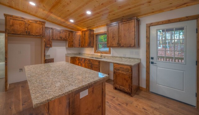 kitchen with wood ceiling, sink, light hardwood / wood-style flooring, and vaulted ceiling