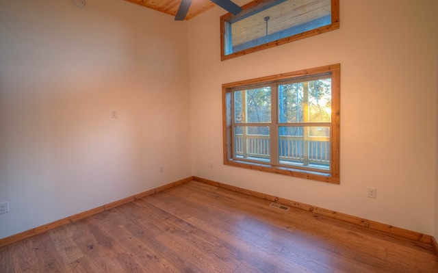 unfurnished room with hardwood / wood-style floors and ceiling fan