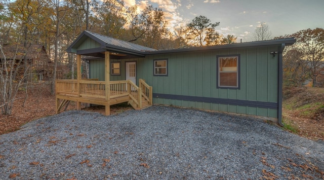 view of front of house with covered porch and a wooden deck