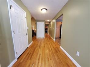 corridor featuring light hardwood / wood-style flooring