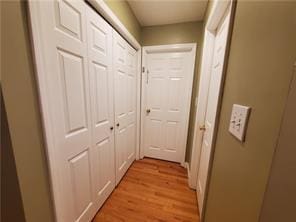 corridor featuring light wood-type flooring