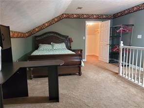 bedroom featuring carpet and vaulted ceiling