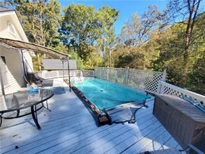 deck with a hot tub