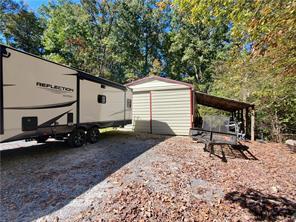 exterior space with a shed