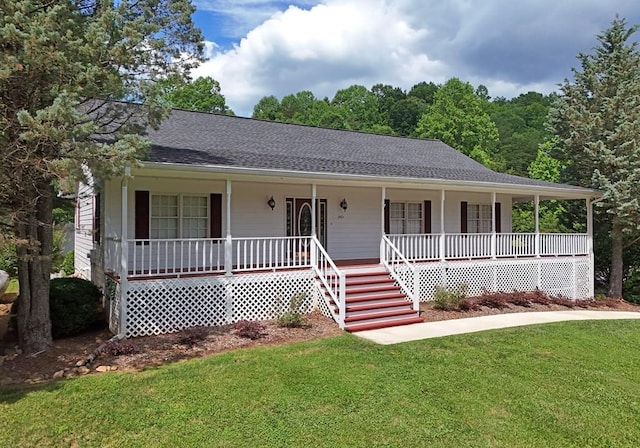 view of front facade with a front yard and a porch