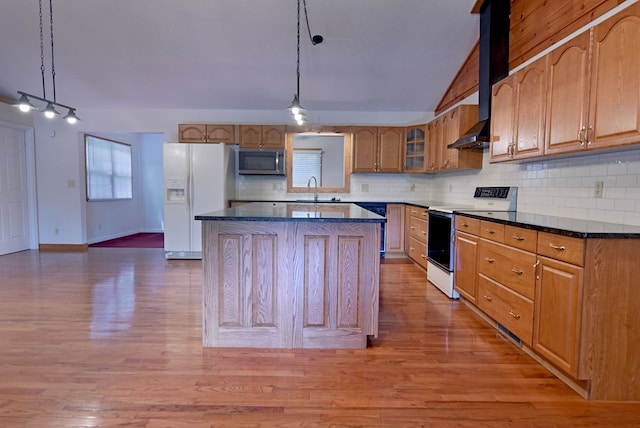 kitchen with pendant lighting, wood-type flooring, and white appliances