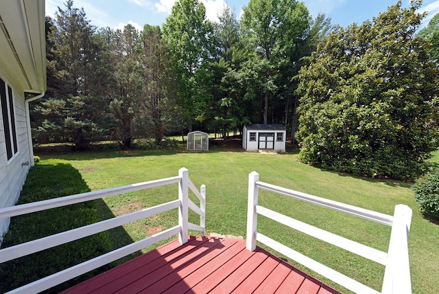 wooden terrace with a yard and a storage unit