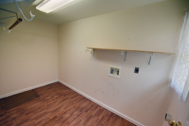 laundry room with washer hookup, dark hardwood / wood-style floors, electric dryer hookup, and a textured ceiling