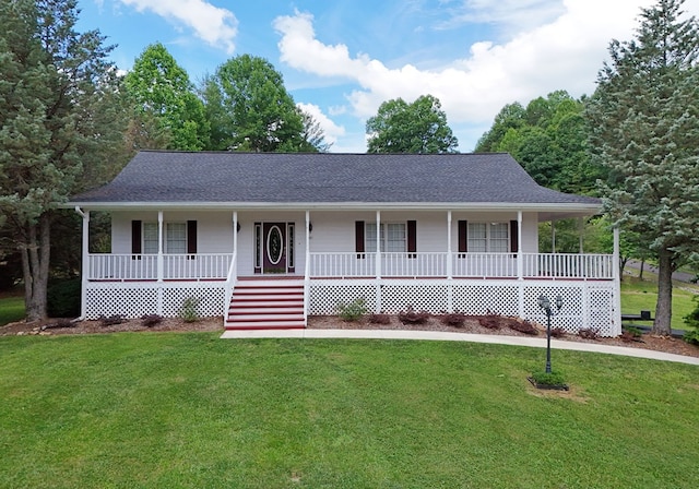 view of front facade with covered porch and a front yard