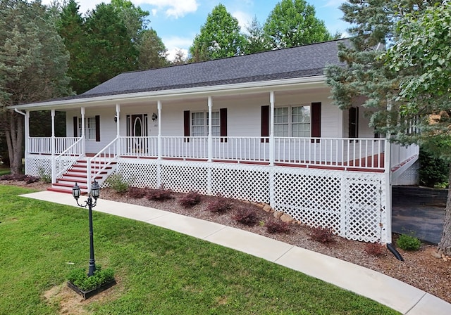 view of front of house with a porch and a front lawn