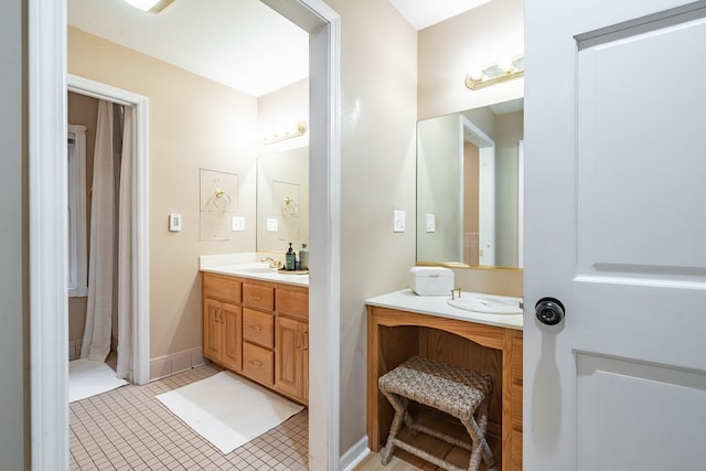 bathroom with tile patterned flooring and vanity