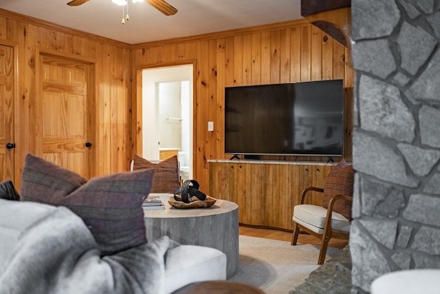 living room featuring ceiling fan and ornamental molding