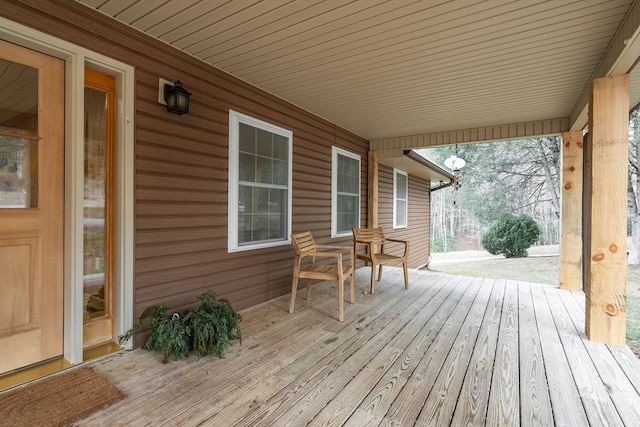 wooden terrace with a porch