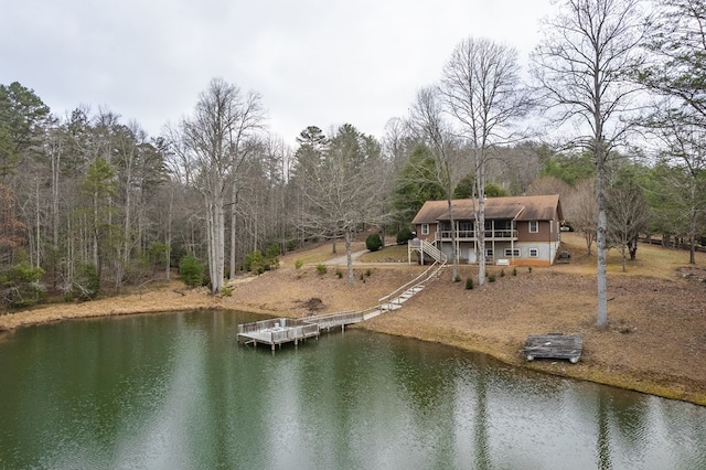 view of dock featuring a deck with water view