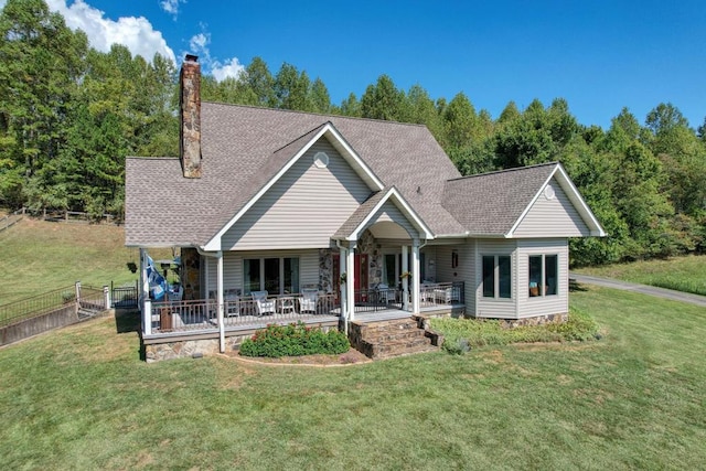 view of front facade with a front yard and a porch