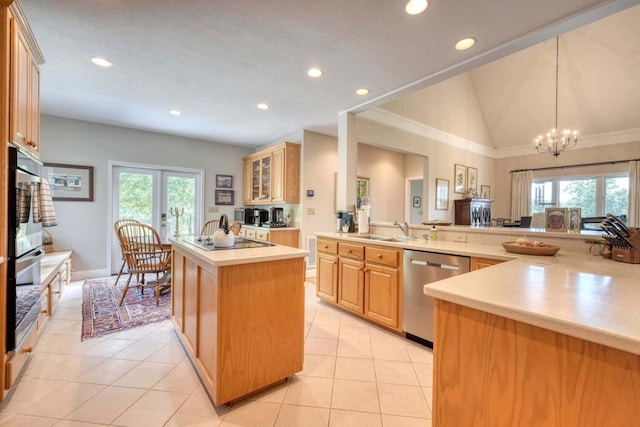 kitchen with lofted ceiling, a center island, dishwasher, and a wealth of natural light