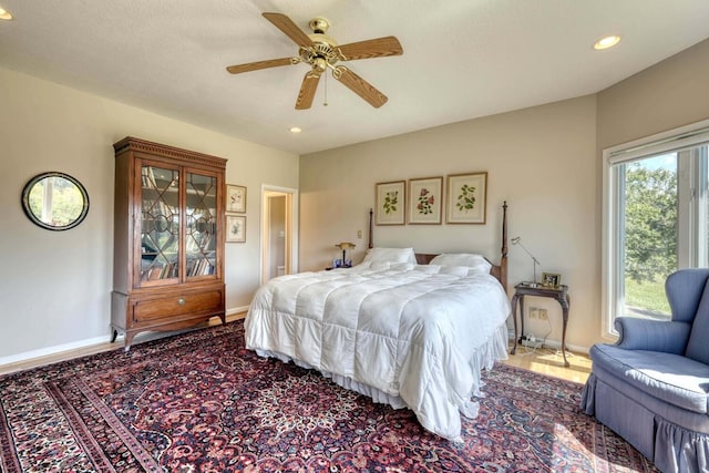 bedroom featuring ceiling fan and a textured ceiling