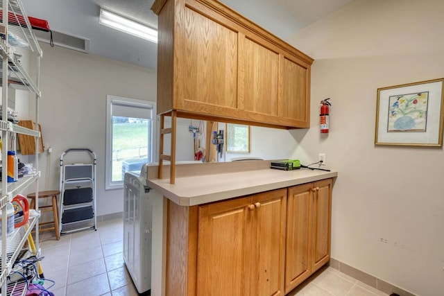 kitchen with light tile patterned floors