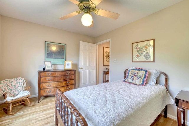 bedroom with light hardwood / wood-style floors and ceiling fan