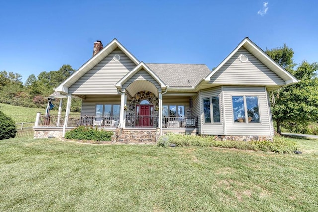 view of front facade with a front lawn and covered porch