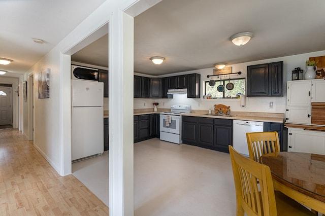 211 Gregory Hollow Rd, Robbinsville, NC 28771 - kitchen with a sink, light countertops, white appliances, and under cabinet range hood