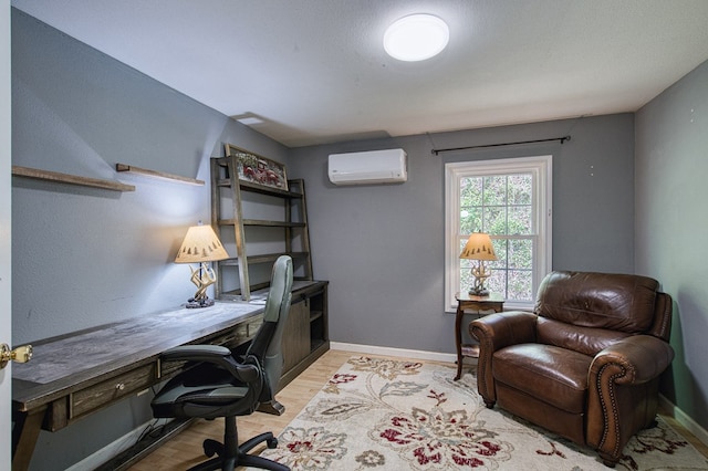 211 Gregory Hollow Rd, Robbinsville, NC 28771 - home office with light wood-style floors, baseboards, and a wall unit AC