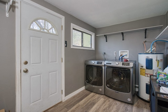 211 Gregory Hollow Rd, Robbinsville, NC 28771 - laundry area featuring baseboards, light wood-style floors, laundry area, electric water heater, and washer and clothes dryer