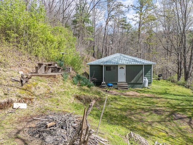 211 Gregory Hollow Rd, Robbinsville, NC 28771 - view of outbuilding with entry steps, a wooded view, and an outbuilding