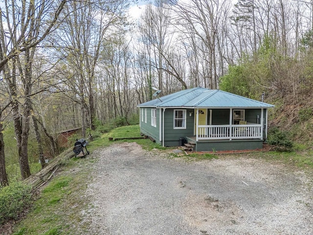 211 Gregory Hollow Rd, Robbinsville, NC 28771 - view of front of house with a chimney, crawl space, driveway, a porch, and metal roof