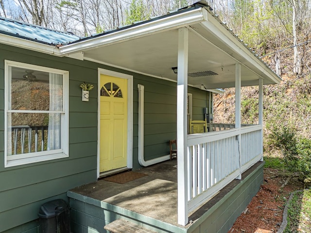 211 Gregory Hollow Rd, Robbinsville, NC 28771 - view of exterior entry featuring metal roof and covered porch