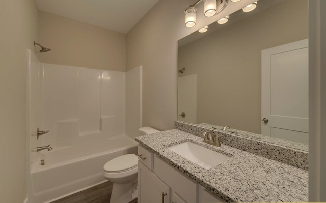 full bathroom featuring shower / bathtub combination, wood finished floors, vanity, and toilet
