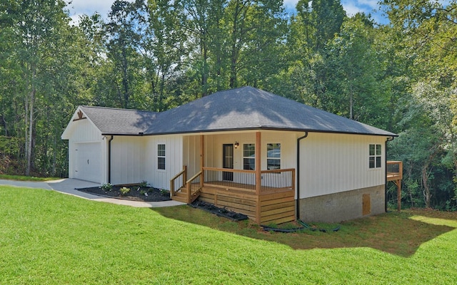 exterior space featuring crawl space, a front lawn, a shingled roof, covered porch, and an attached garage