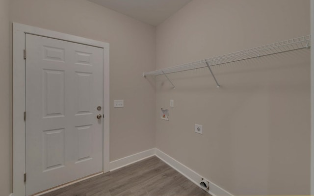 washroom with electric dryer hookup, hookup for a washing machine, and wood-type flooring