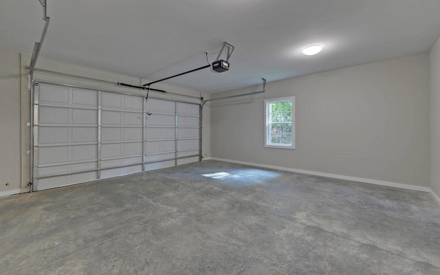 garage featuring baseboards and a garage door opener