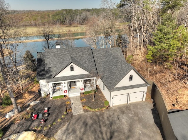 birds eye view of property featuring a water view