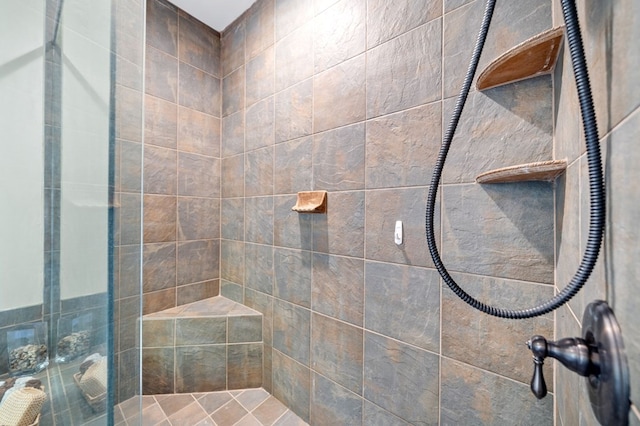 full bath featuring a tile shower