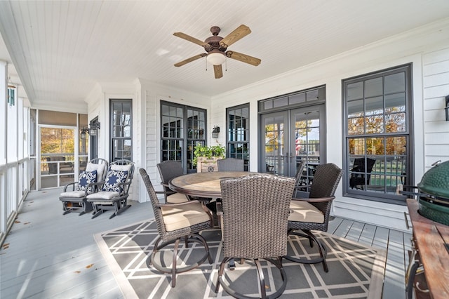 sunroom / solarium featuring wood ceiling, french doors, and ceiling fan