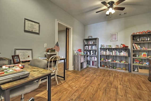 office space featuring visible vents, ceiling fan, and wood finished floors