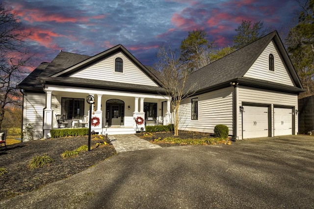 view of front of house with a porch and driveway