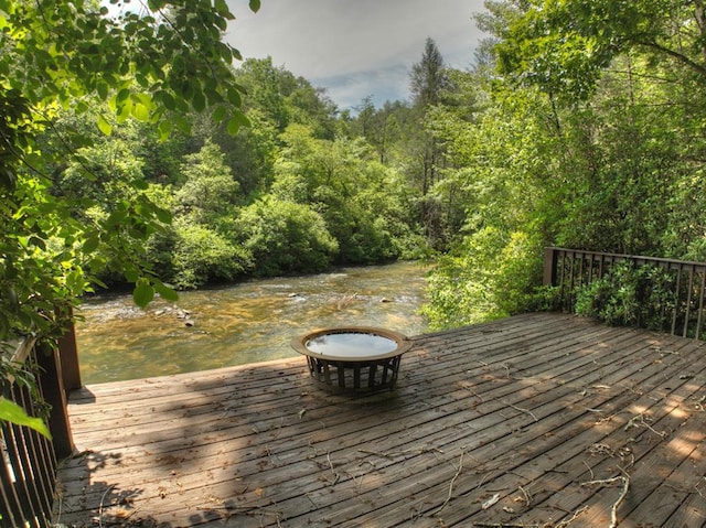 wooden deck with a water view