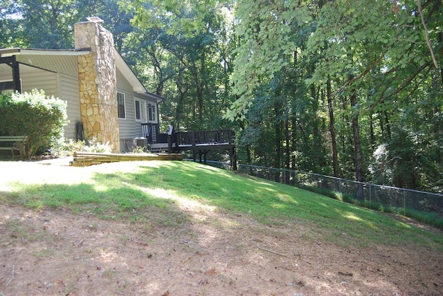 view of yard featuring a wooden deck