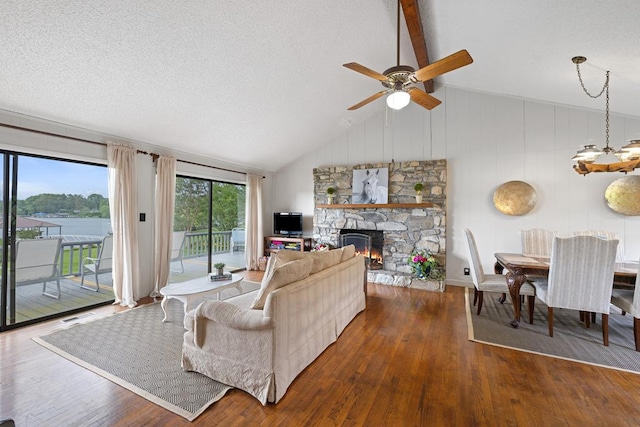 2793 Hidden Valley Rd, Hiawassee, GA 30546 - living room with hardwood / wood-style flooring, ceiling fan, a fireplace, and a textured ceiling