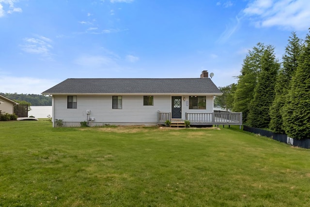 2793 Hidden Valley Rd, Hiawassee, GA 30546 - rear view of property with a chimney, a lawn, and a deck
