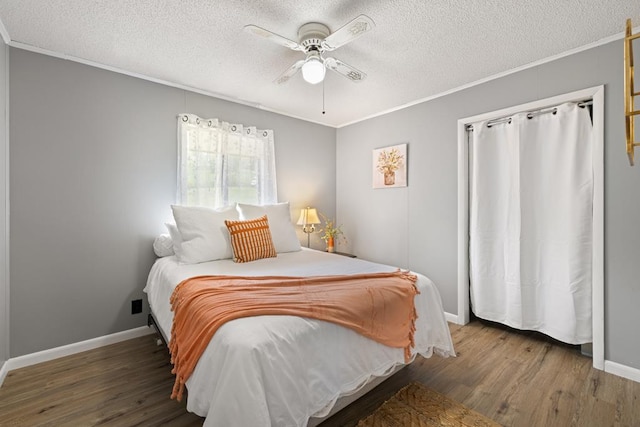 2793 Hidden Valley Rd, Hiawassee, GA 30546 - bedroom with a textured ceiling, wood finished floors, ornamental molding, and ceiling fan