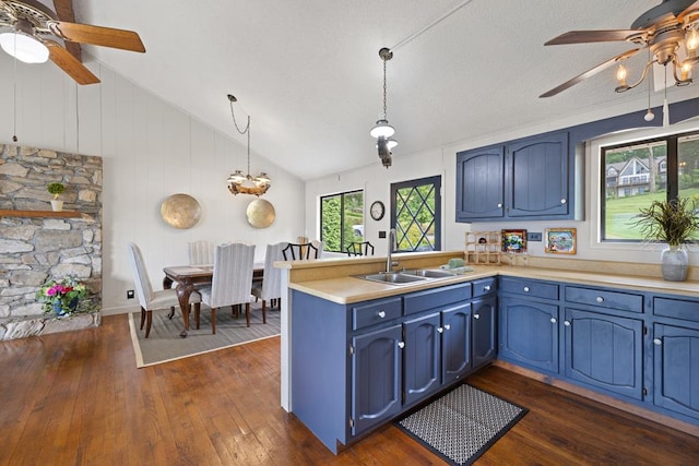 2793 Hidden Valley Rd, Hiawassee, GA 30546 - kitchen with a ceiling fan, a peninsula, blue cabinetry, and lofted ceiling