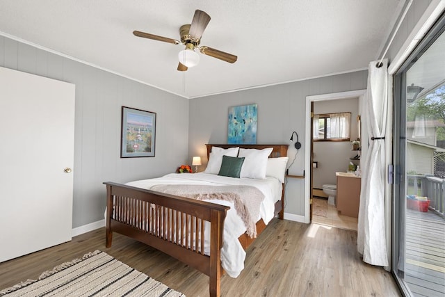 2793 Hidden Valley Rd, Hiawassee, GA 30546 - bedroom featuring light wood-style floors, ornamental molding, ensuite bathroom, a ceiling fan, and baseboard heating